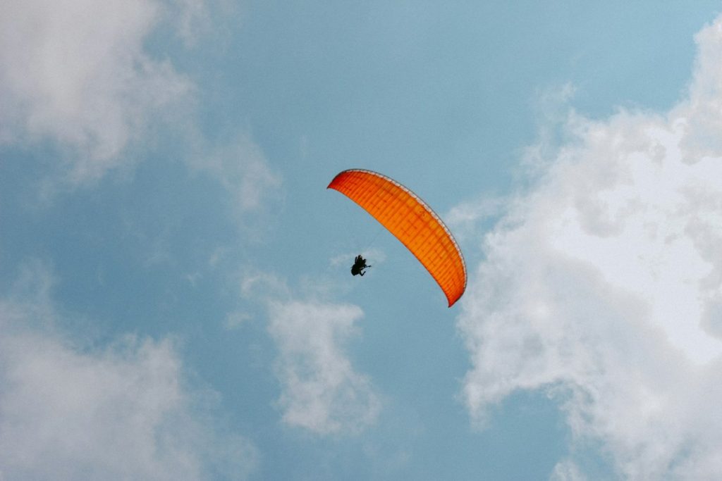 a person parachuting in the sky